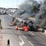 Vehicles burn in blockades on a Guanajuato highway.
