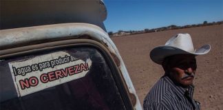 'Water is for producing food not beer,' reads the sticker.