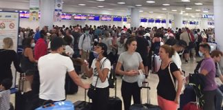 Lineups at Cancún airport as travelers attempt to flee.