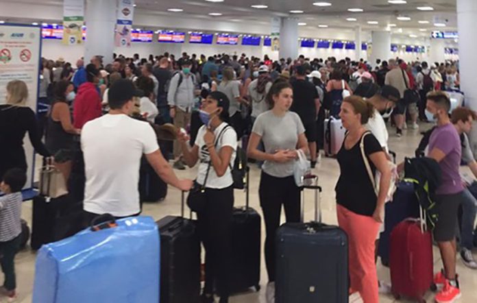 Lineups at Cancún airport as travelers attempt to flee.