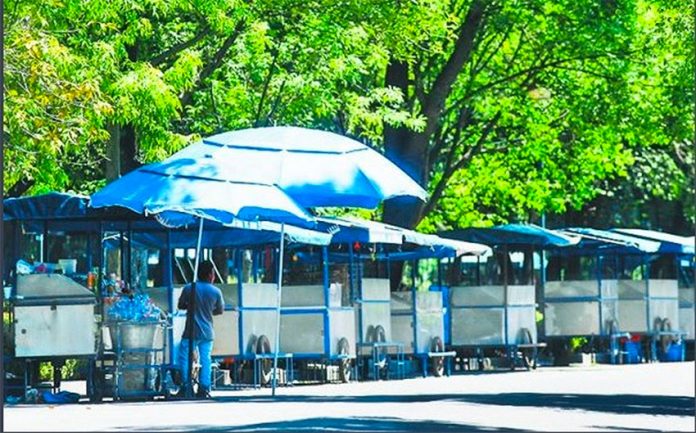 Deserted food carts in Mexico City's Chapultepec Park.