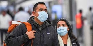 Passengers arrive at Mexico City airport. A doctor says greater efforts should be taken to test travelers.