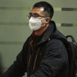 Travelers with face masks have become a common sight at Mexico City airport.