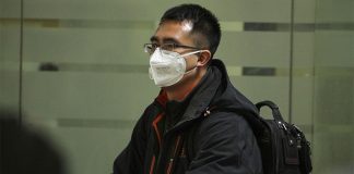 Travelers with face masks have become a common sight at Mexico City airport.