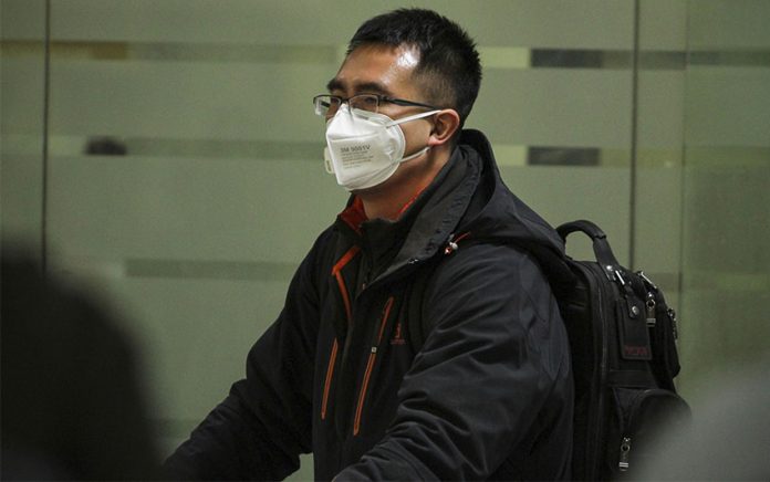 Travelers with face masks have become a common sight at Mexico City airport.