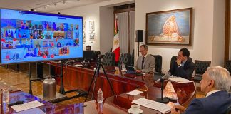 The president and other officials during the G20 video conference.