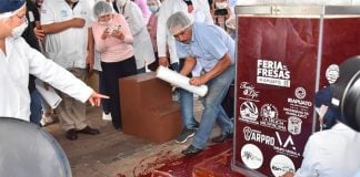 The contents leak out of what was going to be the world's largest jar of strawberry jam.