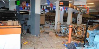 A store in México state that was damaged by looters Monday.