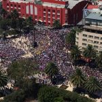 Women march Sunday in Mexico City.