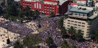 Women march Sunday in Mexico City.