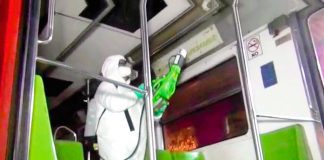 A Mexico City Metro worker disinfects a rail car.