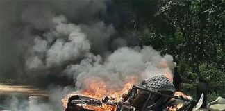 Migrants' belongings burn in Palenque, Chiapas.