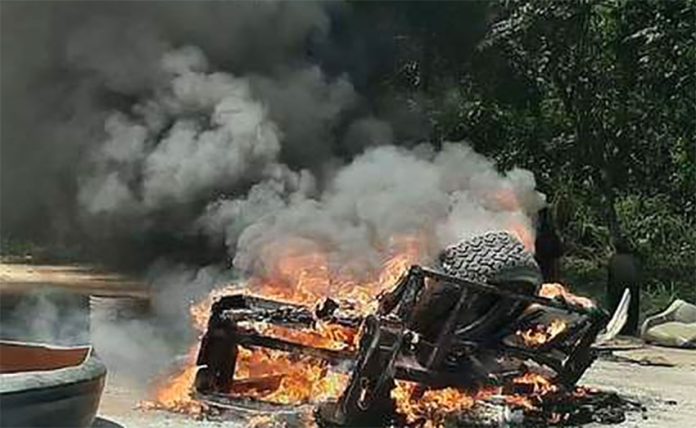 Migrants' belongings burn in Palenque, Chiapas.