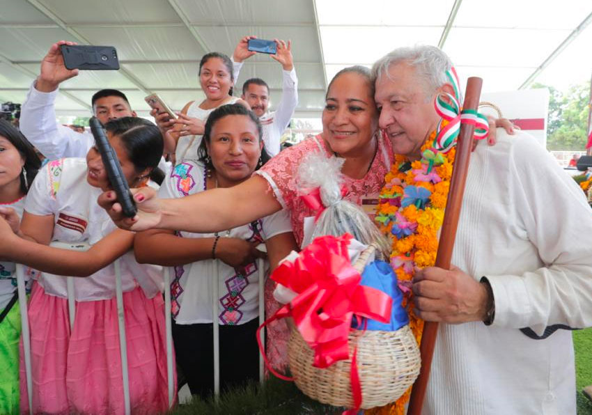 AMLO hugs a fan in Guerrero.