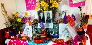 Typical Day of the Dead altar featuring favorite food and drink of the deceased.