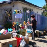 Alexis and his toys outside his Tijuana home.