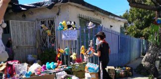 Alexis and his toys outside his Tijuana home.