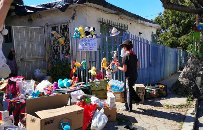Alexis and his toys outside his Tijuana home.