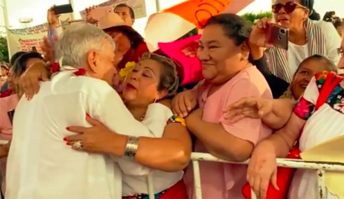 AMLO on tour: hugs for all.