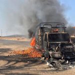 One of several vehicles set on fire to block highways on Sunday.