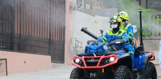 A quad is used to spray a disinfectant in public areas of Santa Catarina, Nuevo León.