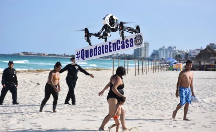 Quintana Roo has put police drones to work carrying the 'stay at home' (Quédate en casa) message.