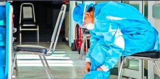 A healthcare worker in Toluca, México state, suits up with protective gear.