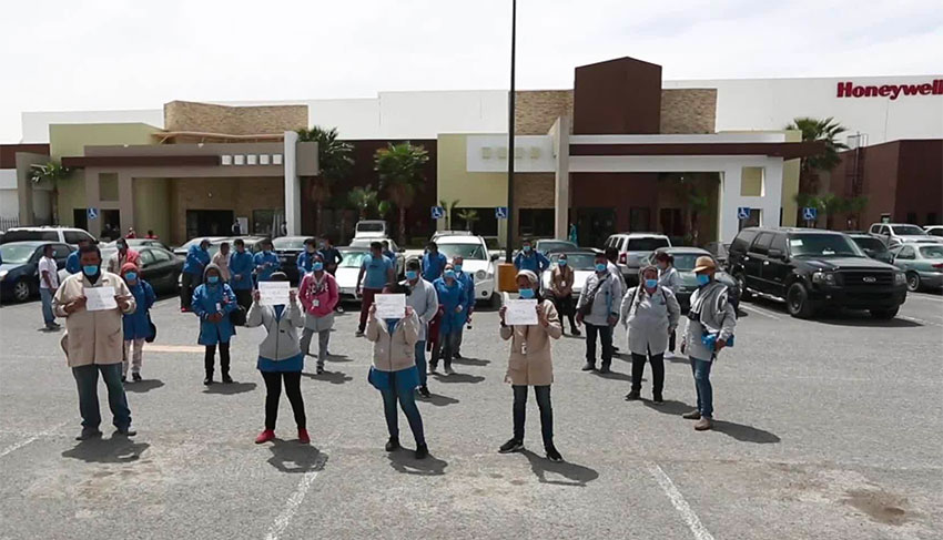 Honeywell workers protest two weeks ago against the company's decision to continue operating.