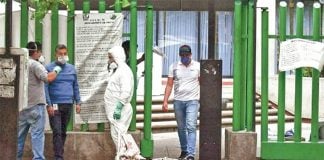 Workers disinfect the hospital in Tlalnepantla on Wednesday.