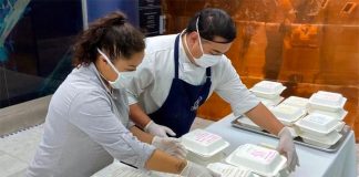 Restaurant staff prepare lunches for healthcare workers.