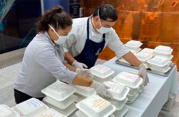 Restaurant staff prepare lunches for healthcare workers.
