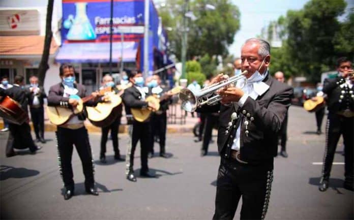 Mariachis play outside a Mexico City hospital on Tuesday afternoon.