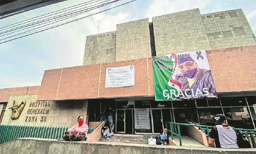 A banner hangs outside the hospital where he worked.