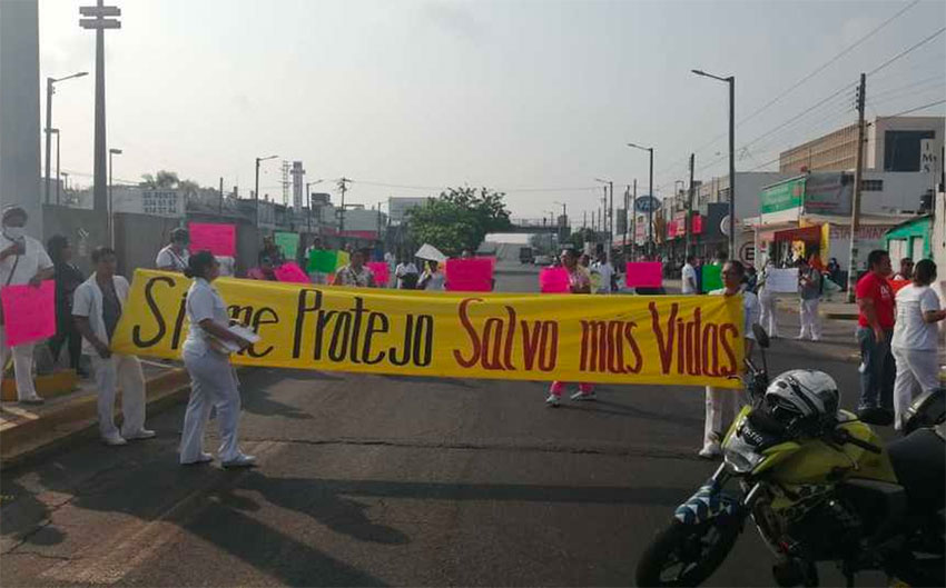Doctors, nurses and other health workers mount a roadblock in Veracruz.