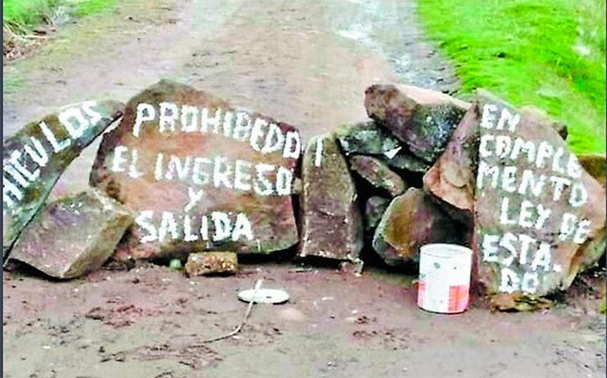 Access prohibited, reads the sign on a pile of rocks.