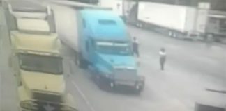 The truck without brakes, center, flies through the toll booth in San Luis Potosí.