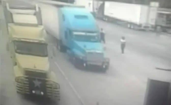 The truck without brakes, center, flies through the toll booth in San Luis Potosí.