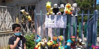 Alexis displays his toys for barter outside his Tijuana home.