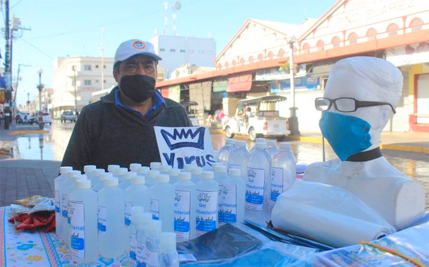 Meja sells masks and gel at his stand in Mazatlán.