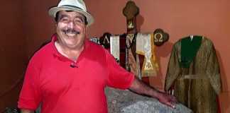 Gabriel Michel — and his winning smile — with glyptodont and vestments at his Jalisco museum.