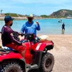 A lifeguard patrols a beach in Mazatlán.