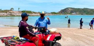 A lifeguard patrols a beach in Mazatlán.