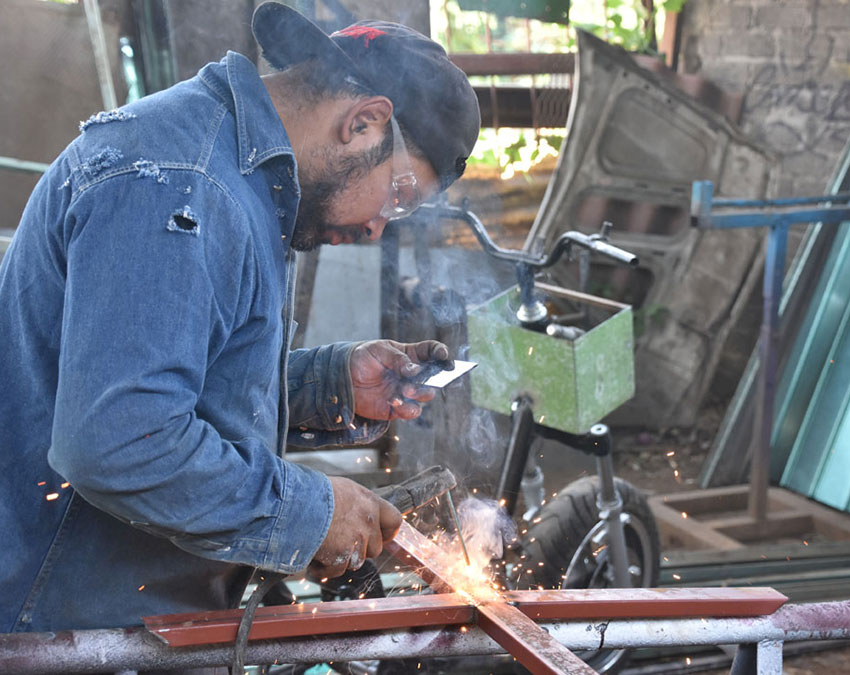 Casteñada at work on one of his crosses.