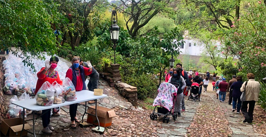 Distribution day: people line up for food and other supplies in Marfil, Guanajuato.