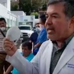 Dr. Rosales with the simple face mask he was given to attend to a patient in the coronavirus ward.