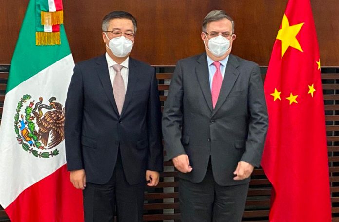 The Chinese ambassador, left and Ebrard.