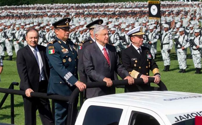 At the July 2019 inauguration of the National Guard, Mexico's top military commanders flank the president