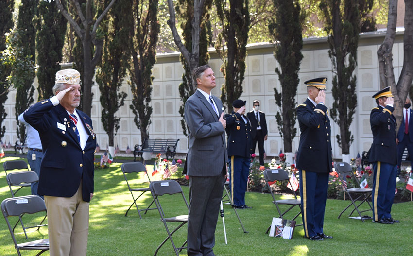 Ambassador Landau, center, at Monday's small Memorial Day ceremony.