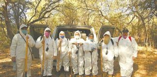 Members of the search collective, dressed for protection against the coronavirus.