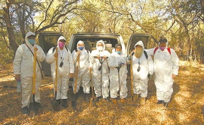 Members of the search collective, dressed for protection against the coronavirus.